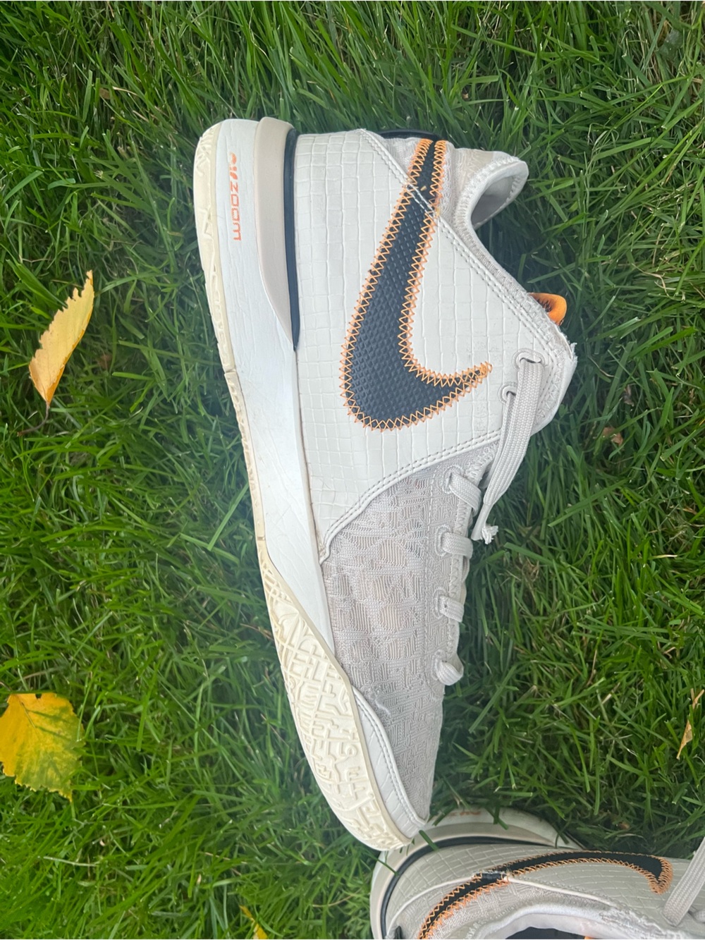 Nike Menβs Light Beige/Off-White Sneakers with Black & Orange Swoosh